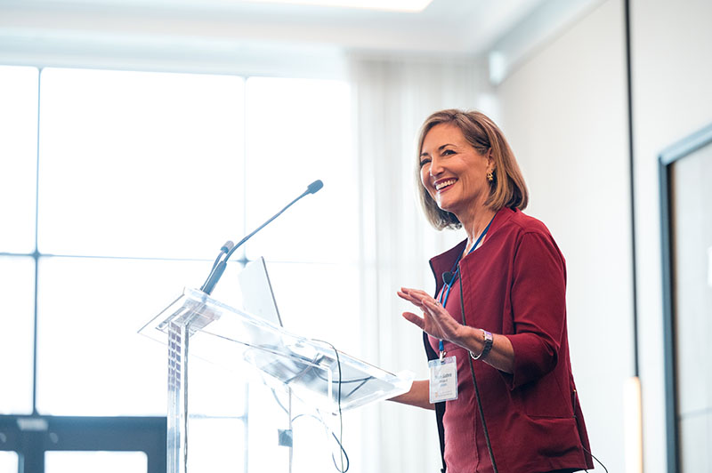 Susan E. Guthrie speaking at a podium